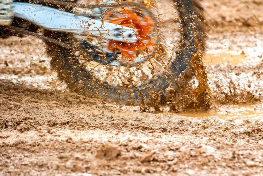 Motorcycle on a Muddy Road