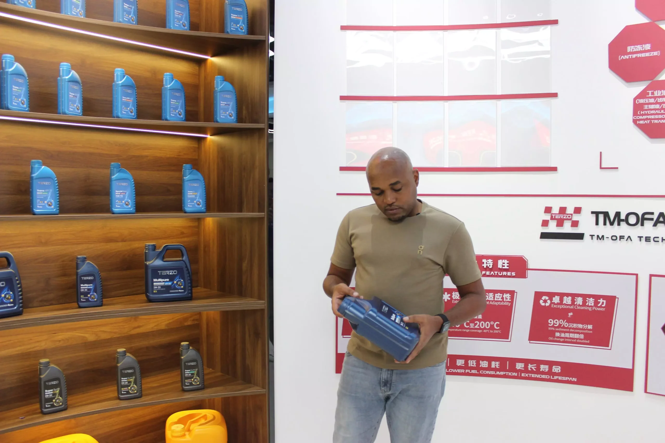 Tanzanian distributor reviewing TERZO engine oil packaging and product range